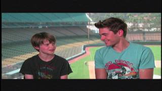 Zac Efron and Charlie Tahan hanging out at Dodgers Stadium discussing Charlie St Cloud