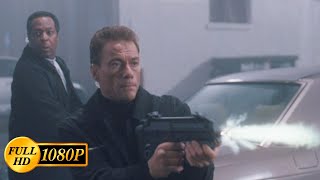 JeanClaude Van Damme fights off bandits in a car with a submachine gun  The Hard Corps 2006