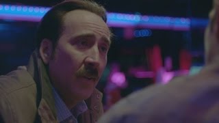 EXCLUSIVE Nicolas Cage and Elijah Wood Team Up And Share a Strange Snack in The Trust