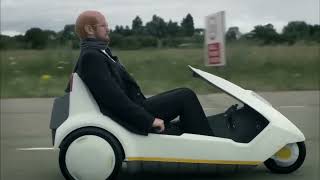 Sir Clive Sinclair in his C5 is overtaken by HP and Microsoft  Alexander Armstrong in Micro Men