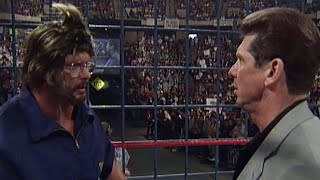 Stone Cold Steve Austin disguises himself as a cameraman to launch a sneak attack on Mr McMahon