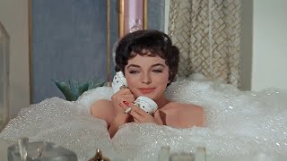 Joan Collins smoking cigarette in The Opposite Sex  