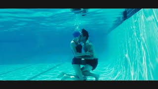 Lessons in Chemistry Season1 Episode2 Brie Larson and Lewis Pullman kissing underwater 2023