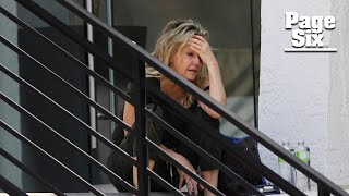 Heather Locklear appears distressed bizarrely walks on ledge of office building