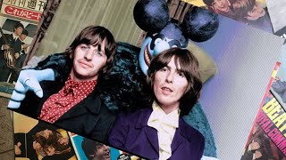  George Harrison and Ringo Starr posing with a Blue Meanie from the Beatles Yellow Submarine 1968